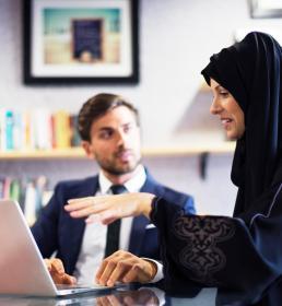 Financial businesswoman talking to her collegue