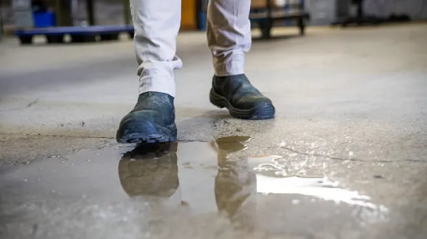 Man about to slip in puddle
