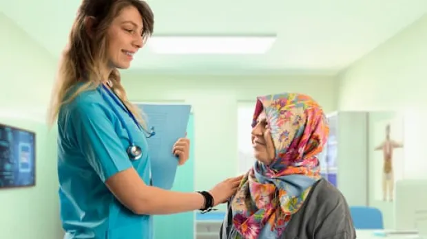 Woman doctor and elderly female patient 
