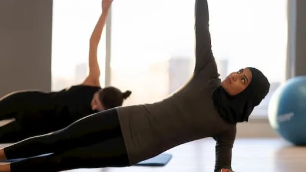 Woman doing yoga on the floor