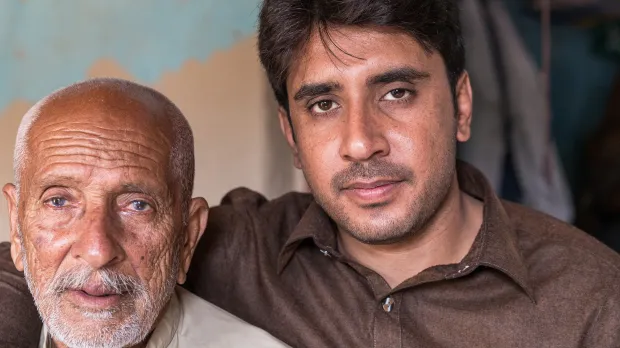 Omani middle aged father and grown up son
