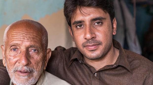 Omani middle aged father and grown up son
