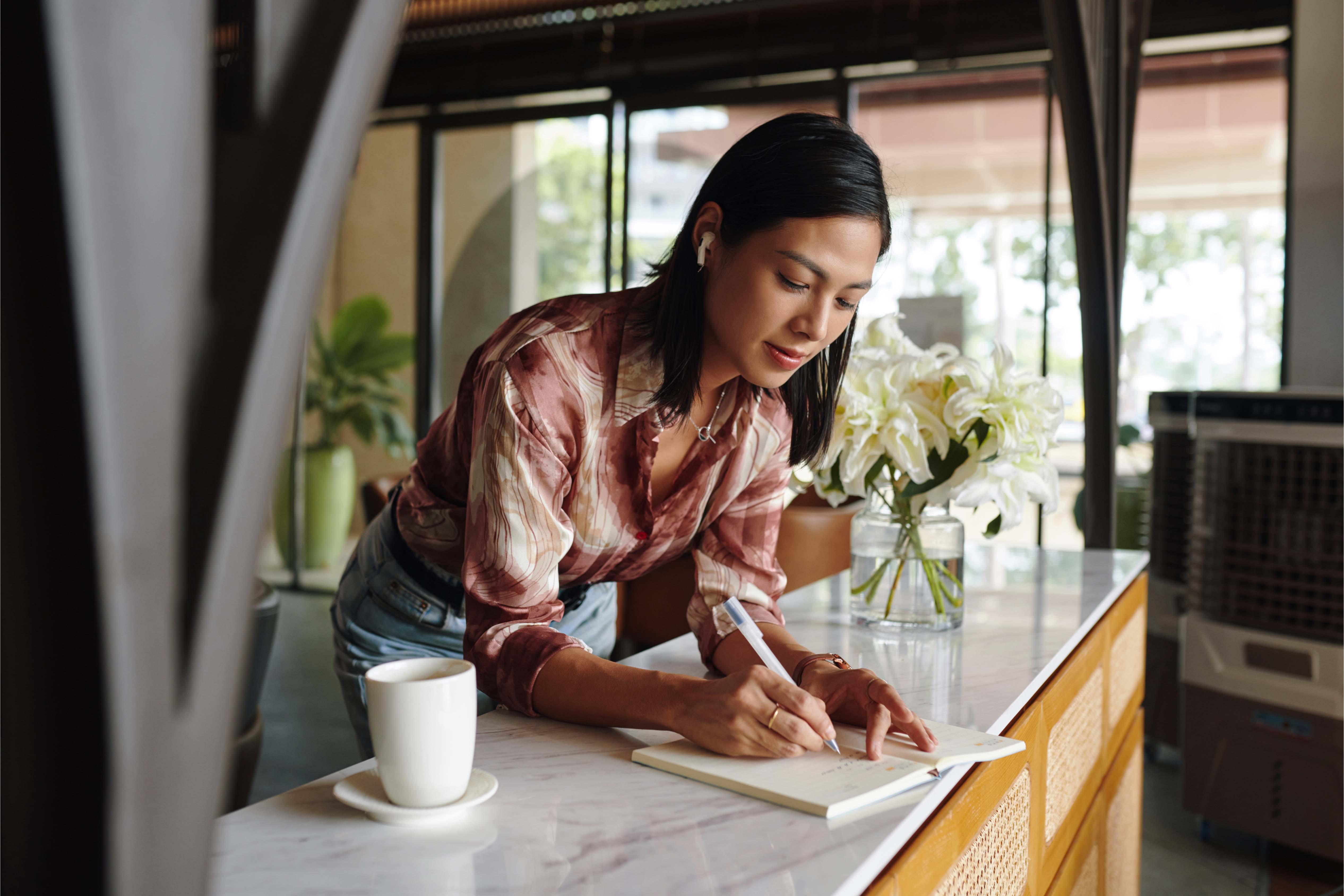 A Filipina business owner working in her shop, representing the energy and dedication of SMEs in the Philippines.