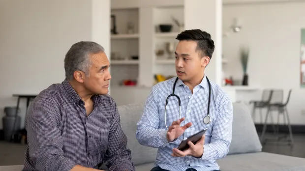 Doctor giving patient his prognosis Doctor giving patient his prognosis