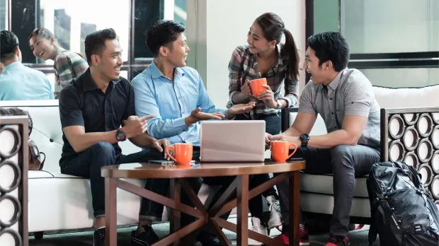 young_southeast_asian_professionals_collaborating_over_coffee_in_an_informal_meeting_space.jpg