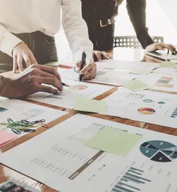 Asset or hedge fund managers look over financial charts