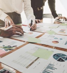 Asset or hedge fund managers look over financial charts