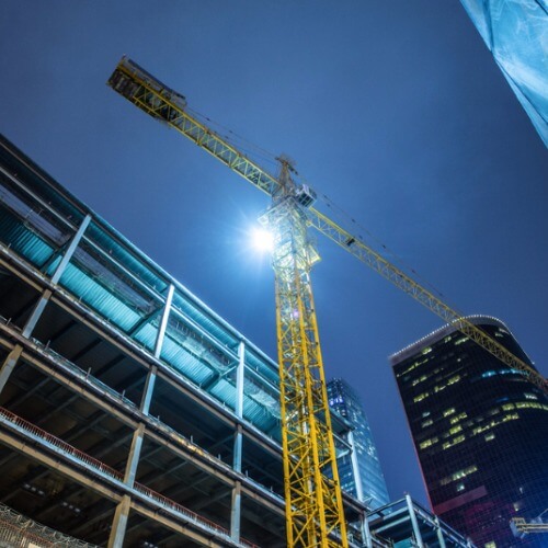 Building under construction with crane