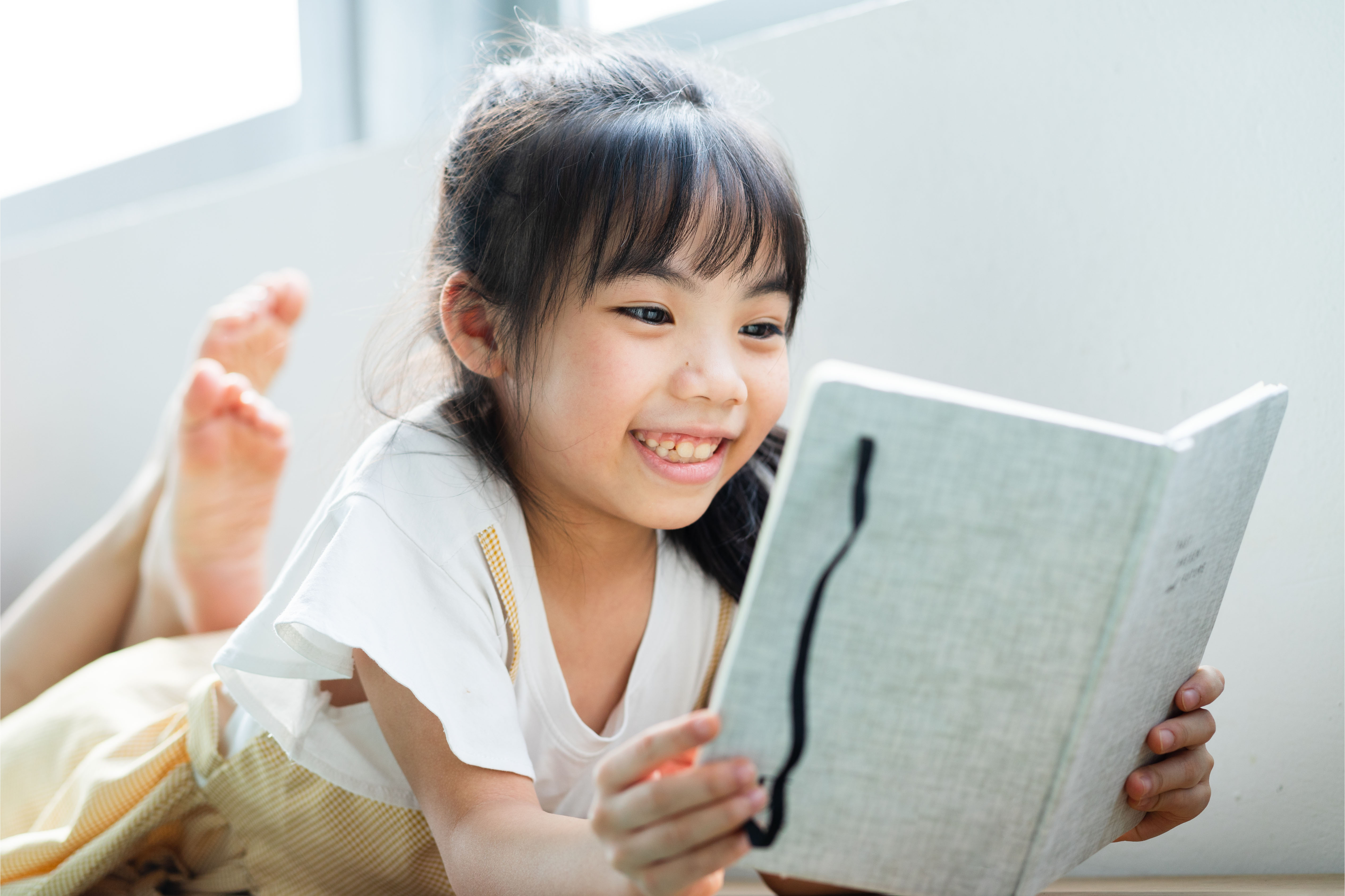 Asian girl reading a book