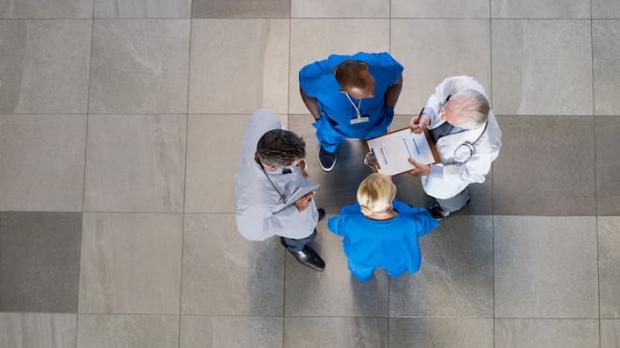 Doctors discussing a patient overhead shot