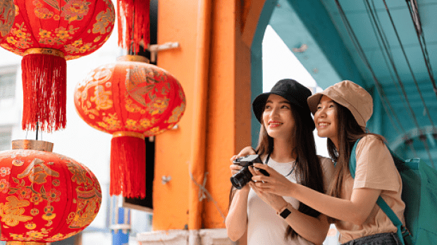 Asian friends walking in the streets of Bangkok