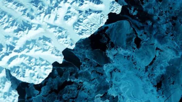 The eastern side of Russia's Kamchatka Peninsula juts into the Pacific Ocean west of Alaska. In this winter image, a volcanic terrain is hidden under snow-covered peaks