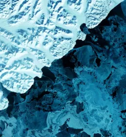 The eastern side of Russia's Kamchatka Peninsula juts into the Pacific Ocean west of Alaska. In this winter image, a volcanic terrain is hidden under snow-covered peaks