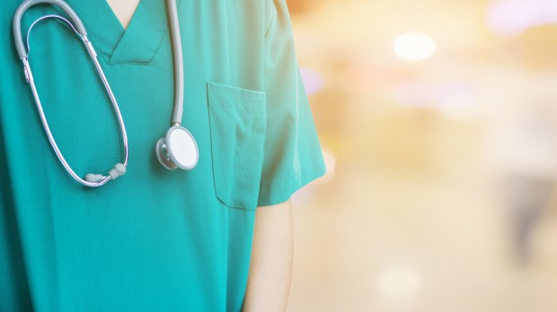 Doctor in green scrubs