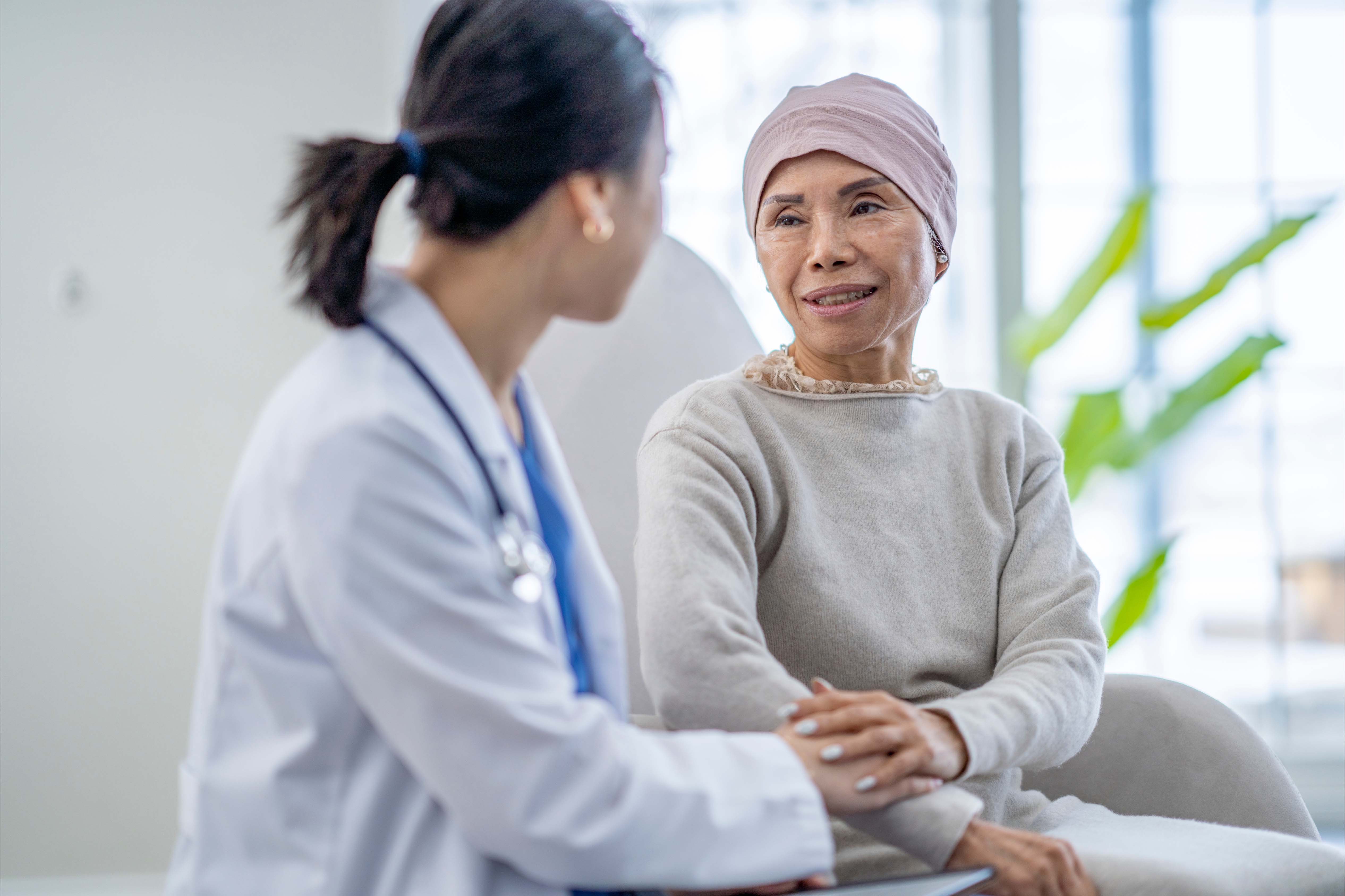 Doctor providing compassionate care and reassurance to a female patient in a clinical setting