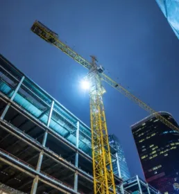 Building under construction with crane 