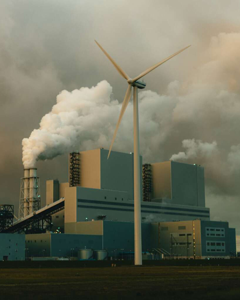 A gloomy image of a power station polluting the air