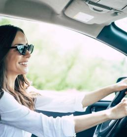 A lady driving a car