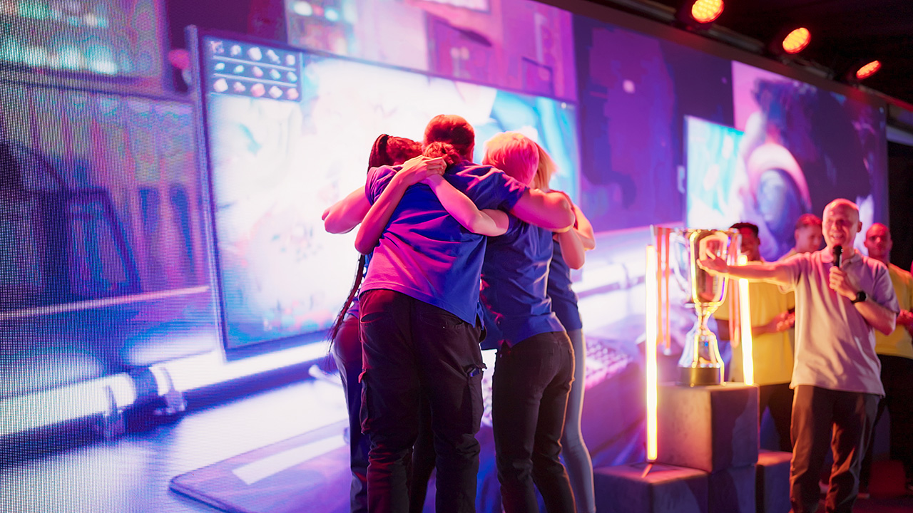 People hugging on stage