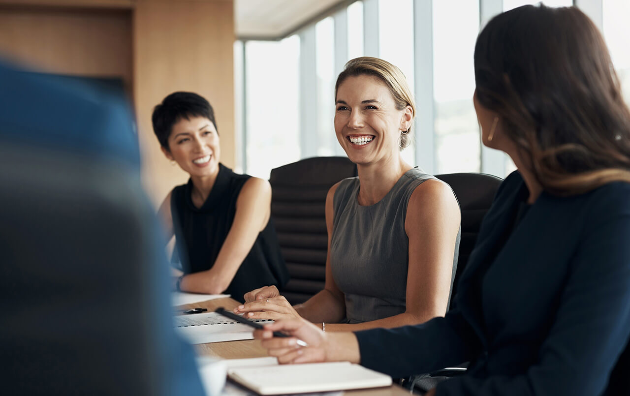 People smiling in a meeting
