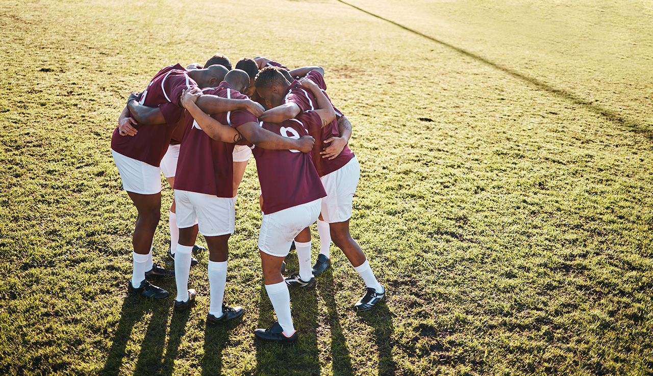 Sports team in a huddle