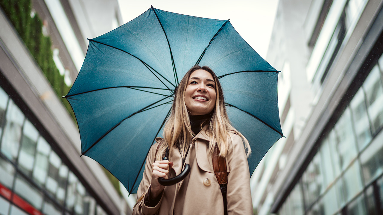 Woman holding a blue umbrella