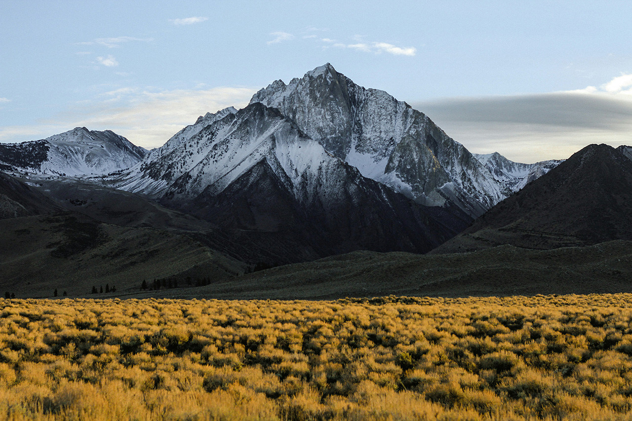 Snow covered mountain in shadow