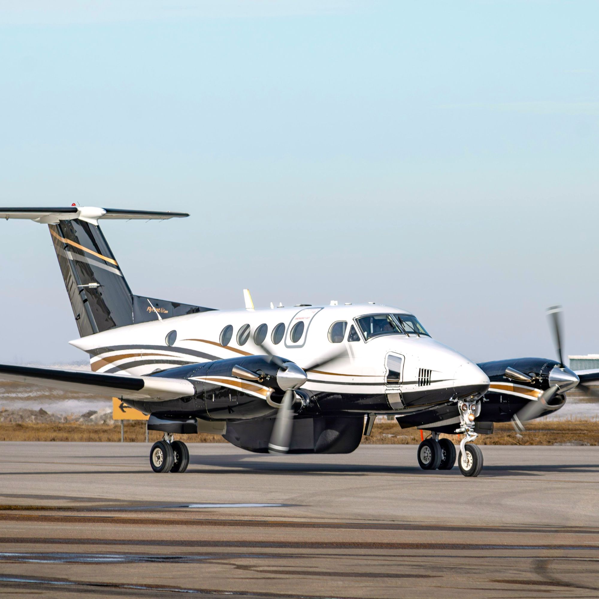 Blue and white private jet