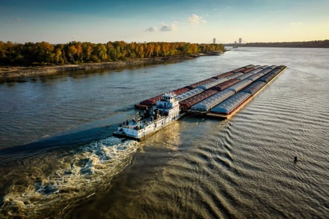 Towboat with barge in river