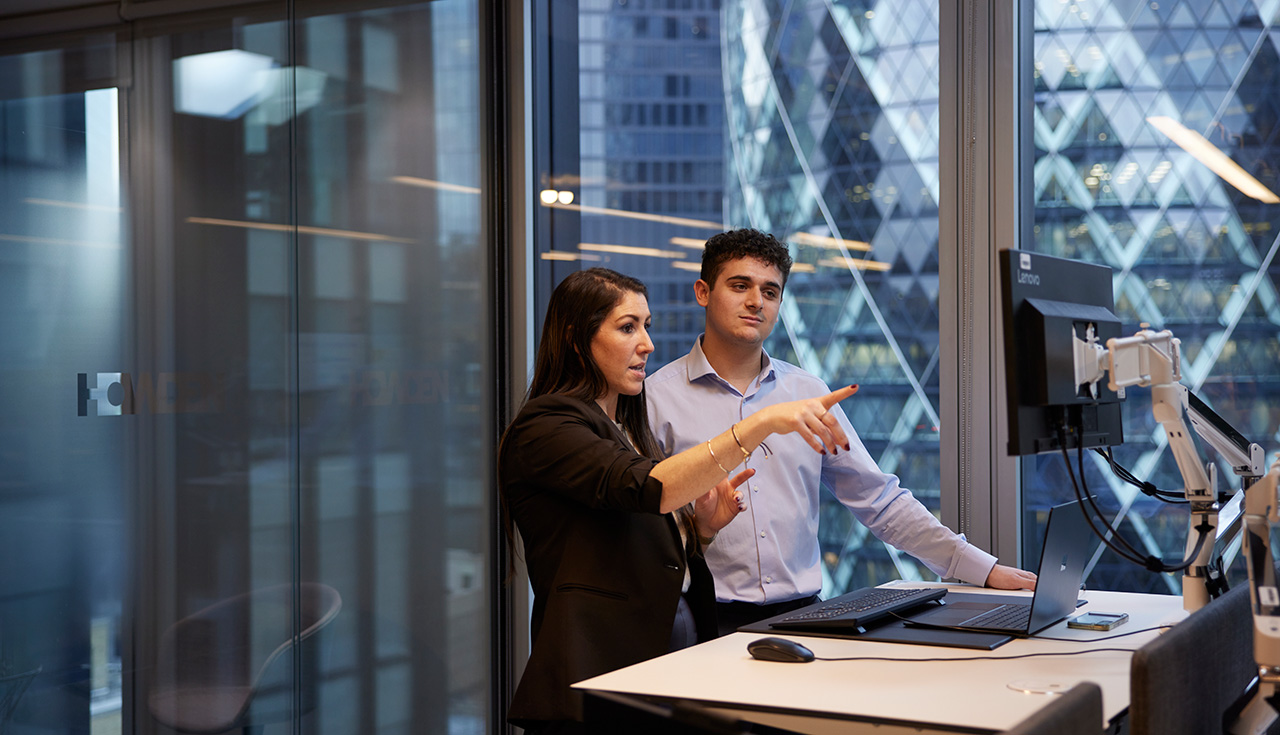 Two people working at a desk