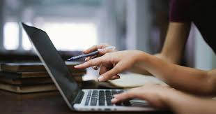 Hands on a computer keyboard