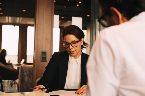 2 professionals conducting a meeting